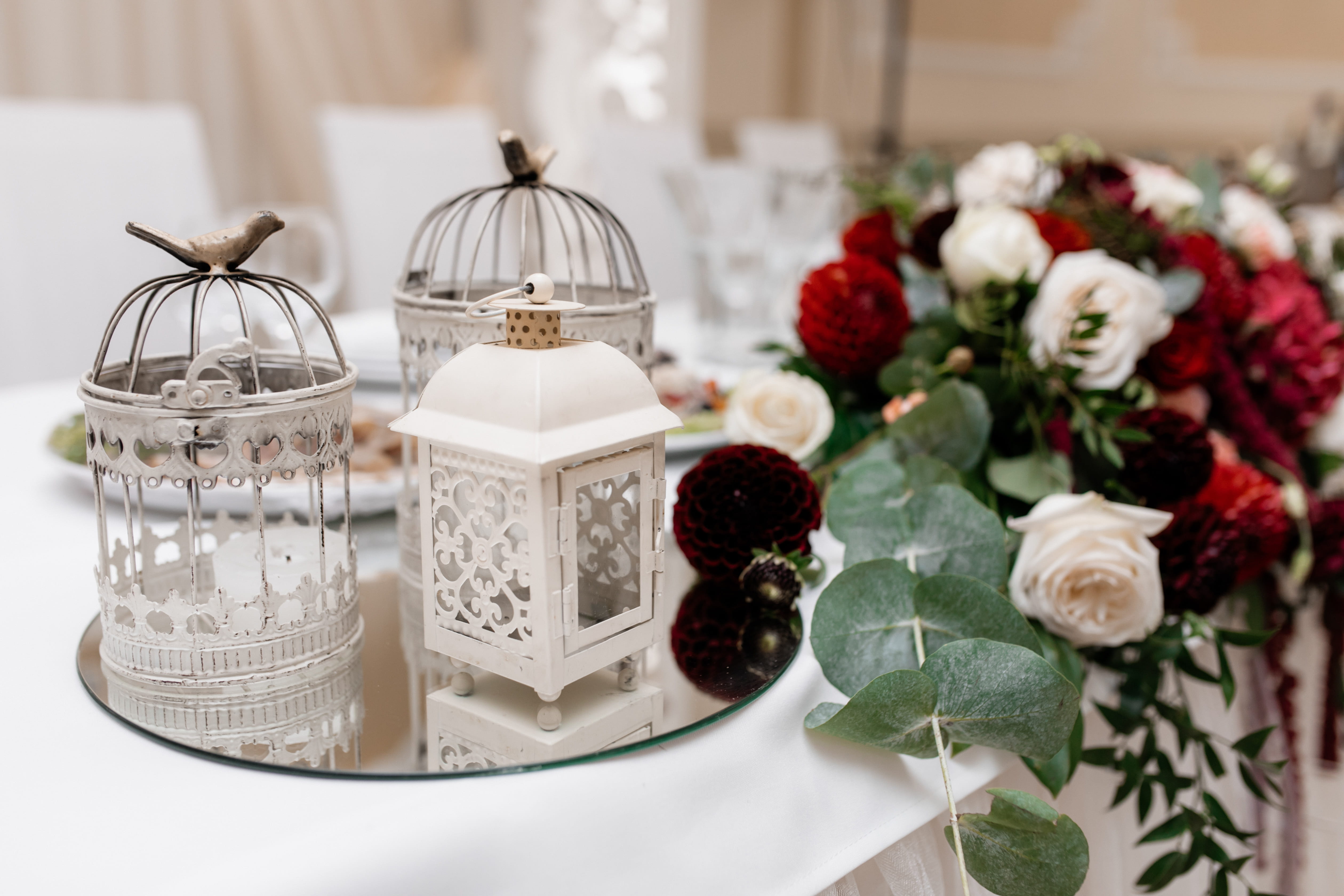 Floral wedding table arrangement with wheat and seasonal blooms